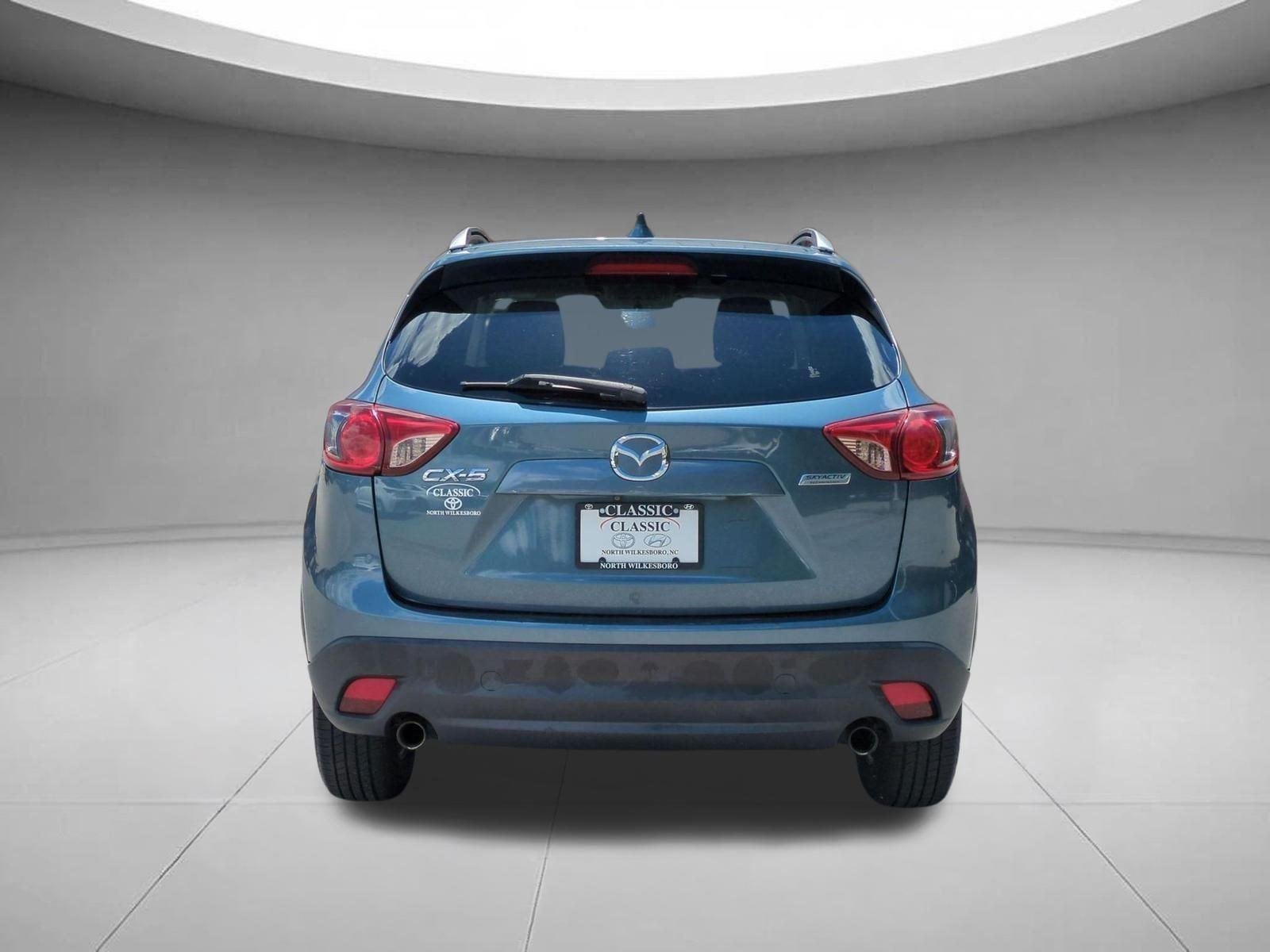 Used 2015 Blue Reflex Mica Mazda Touring image 4