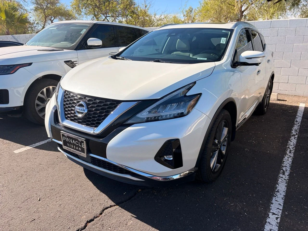 Used 2021 Pearl White Nissan Platinum image 1