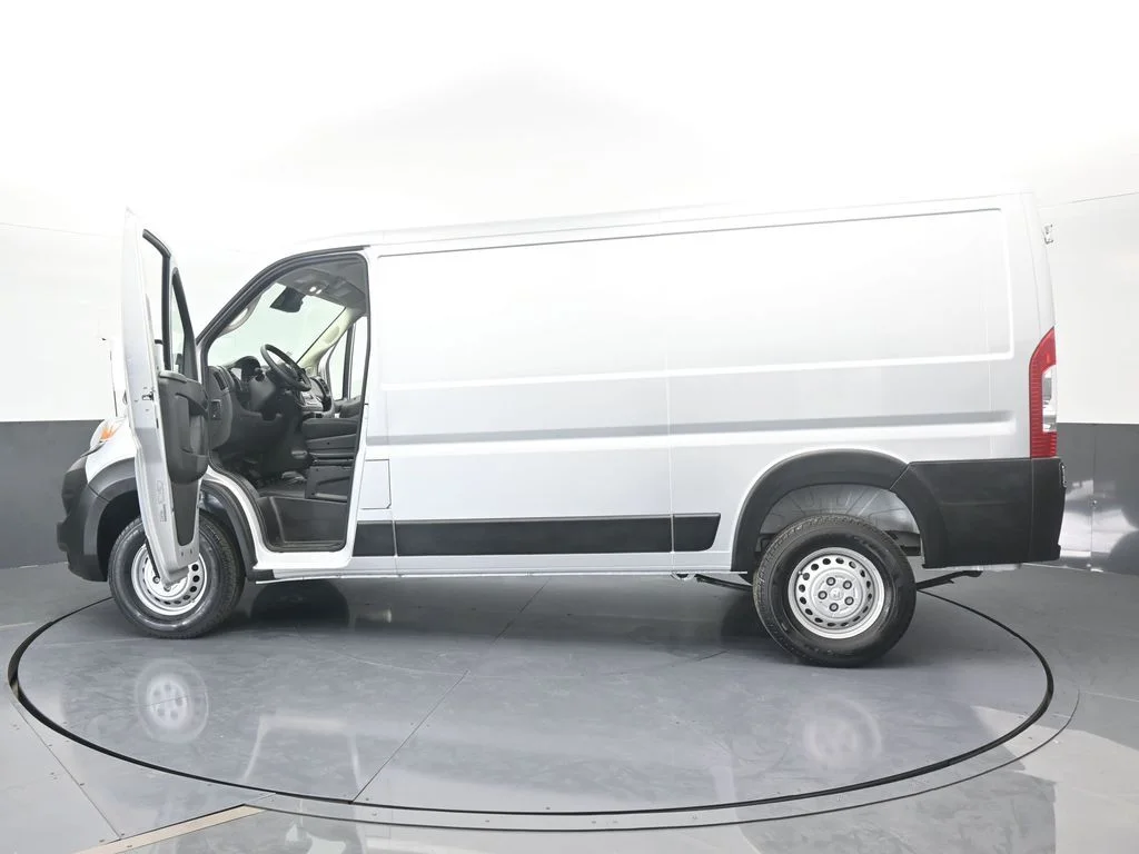 Used 2025 Bright Silver Clearcoat Metallic Ram Low Roof image 64