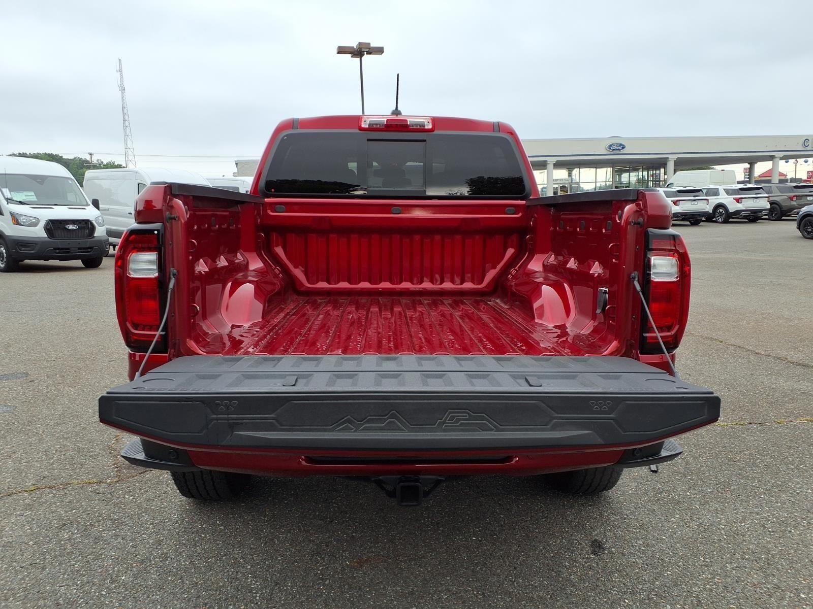 Used 2025 Volcanic Red Tintcoat GMC 4WD AT4 image 32
