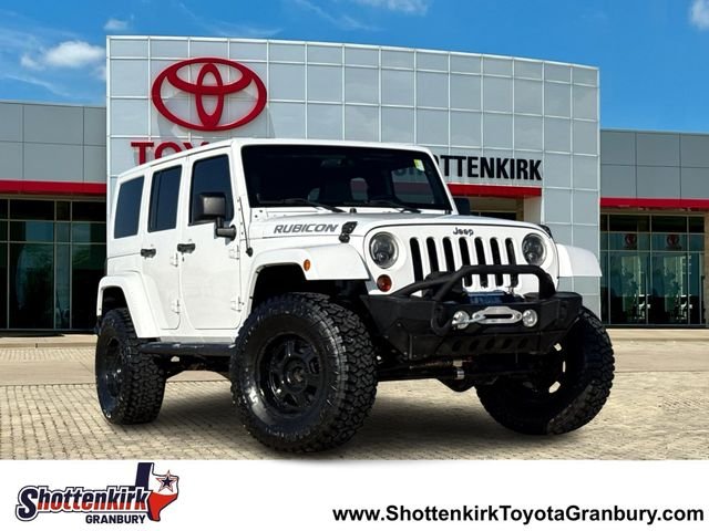 Used 2012 White Jeep Unlimited Rubicon image 1