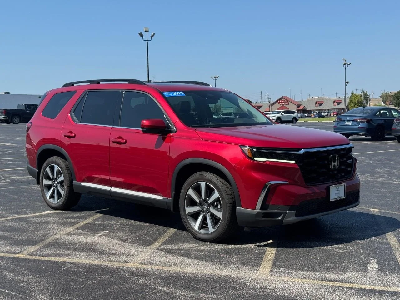 Certified Used 2025 Radiant Red Metallic II Honda AWD TRG image 2