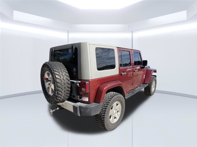 Used 2010 Red Jeep Unlimited Sahara image 6