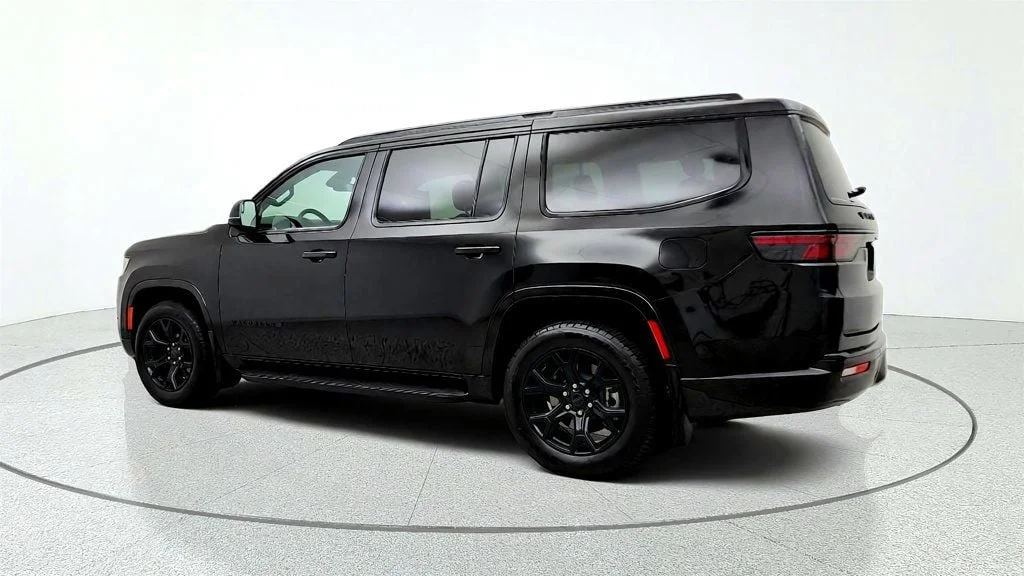 Used 2025 Diamond Black Crystal Pearlcoat Jeep Series II Carbide 4x4 w/ Rear Entertainment & 20