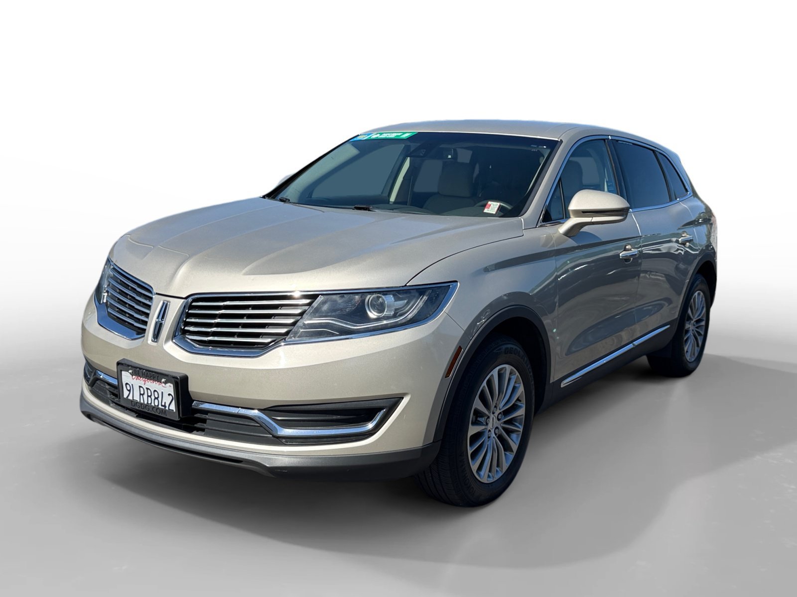 Used 2017 White Gold Metallic Lincoln Select image 1