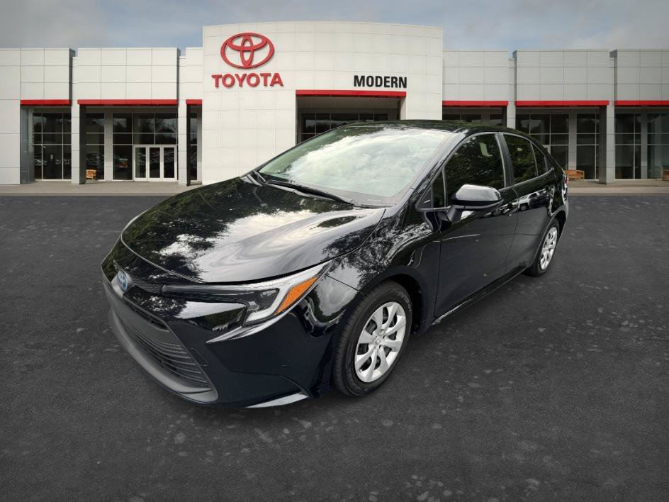 Used 2024 Midnight Black Metallic Toyota Hybrid LE image 1