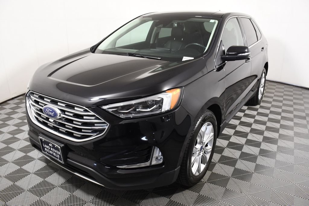 Used 2022 Agate Black Metallic Ford Titanium image 1