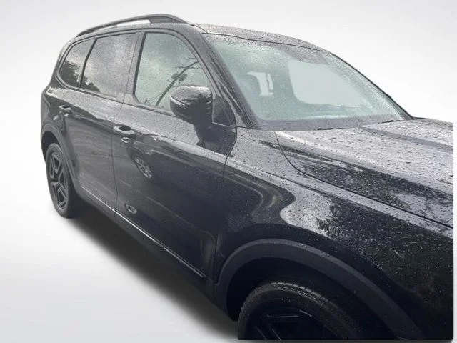 Used 2025 Black Kia EX X-Line image 1