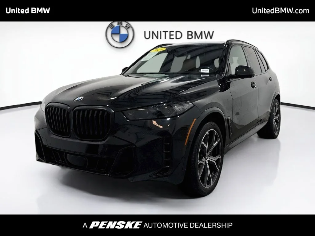 Used 2024 Black Sapphire Metallic BMW sDrive40i image 1