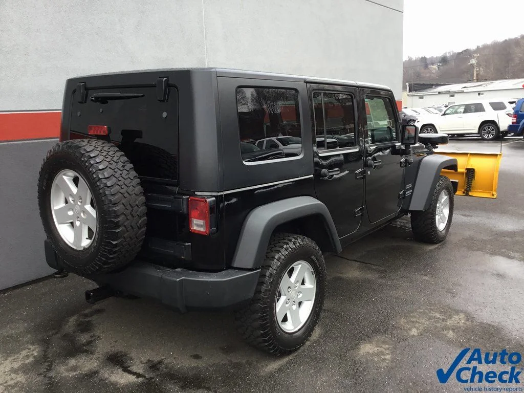 Used 2010 Black Jeep Unlimited Sport image 11