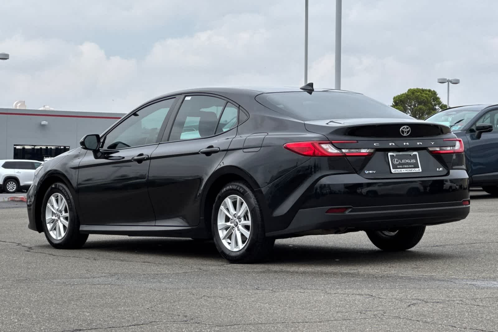 Used 2025 Midnight Black Metallic Toyota LE image 7