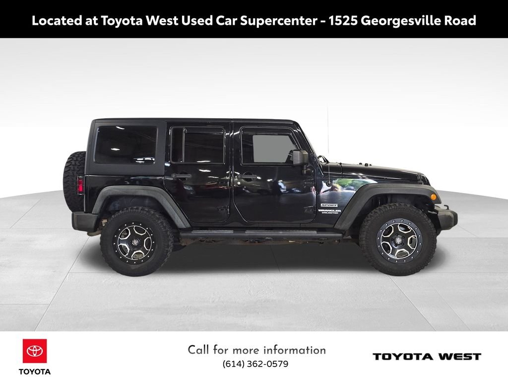 Used 2013 Black Jeep Unlimited Sport image 4