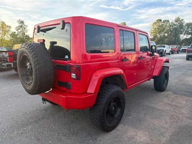 Used 2015 Red Jeep Unlimited Sahara image 6