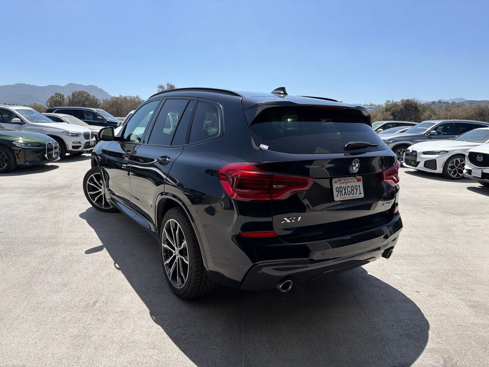 Used 2021 Carbon Black Metallic BMW sDrive30i image 2