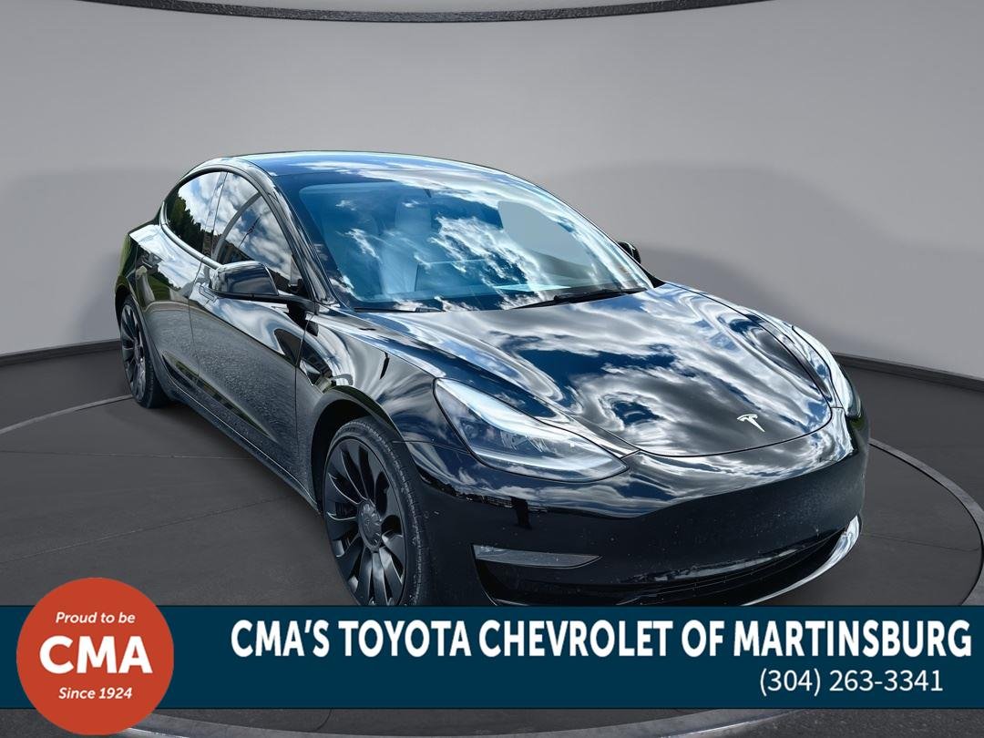 Used 2022 Solid Black Tesla Performance image 1