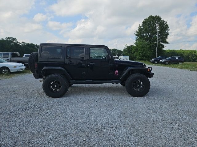 Used 2013 Black Jeep Unlimited Sahara image 5
