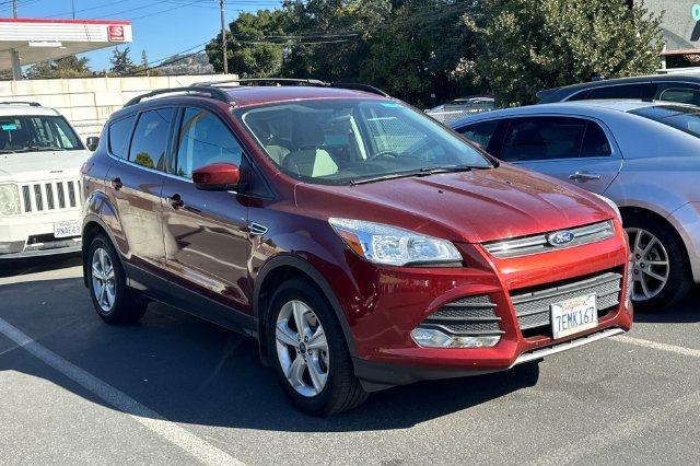 Used 2014 Orange Ford SE image 2