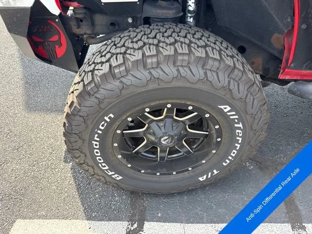 Used 2015 Firecracker Red Jeep Unlimited Sport image 13