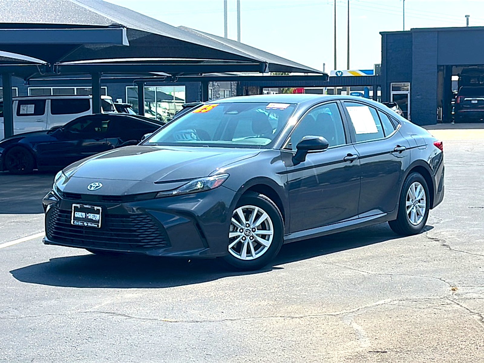 Used 2025 Super Black Toyota LE image 2