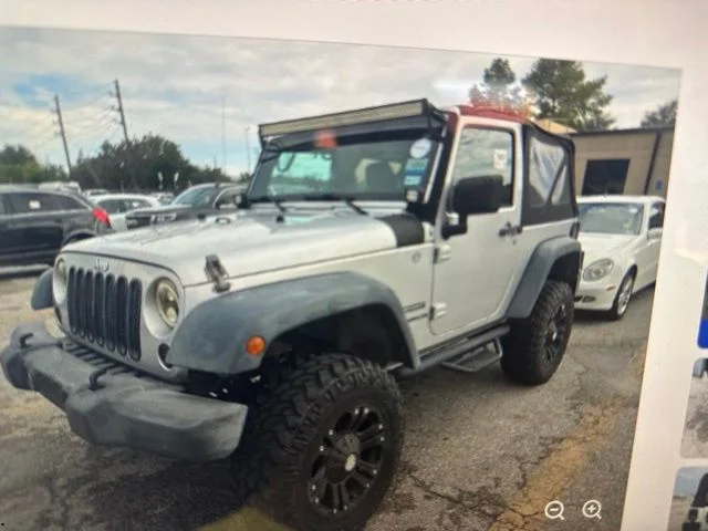 Used 2012 Bright Silver Metallic Jeep Sport image 1