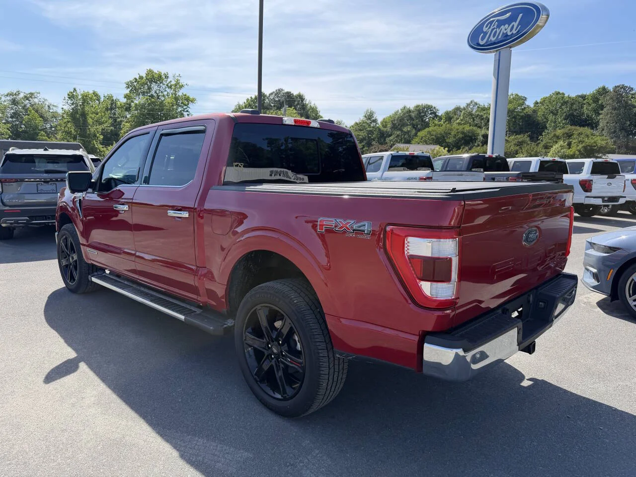 Certified Used 2023 Red Ford Lariat 4x4 4dr SuperCrew 5.5 ft. SB image 3