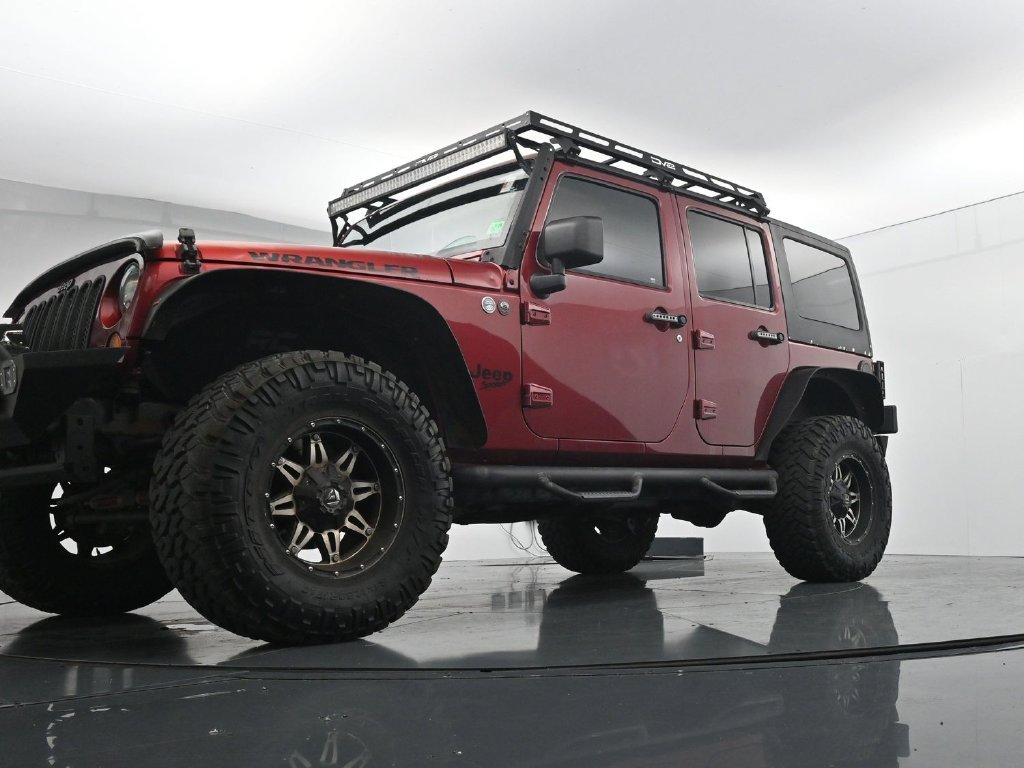 Used 2012 Red Jeep Unlimited Sport image 20