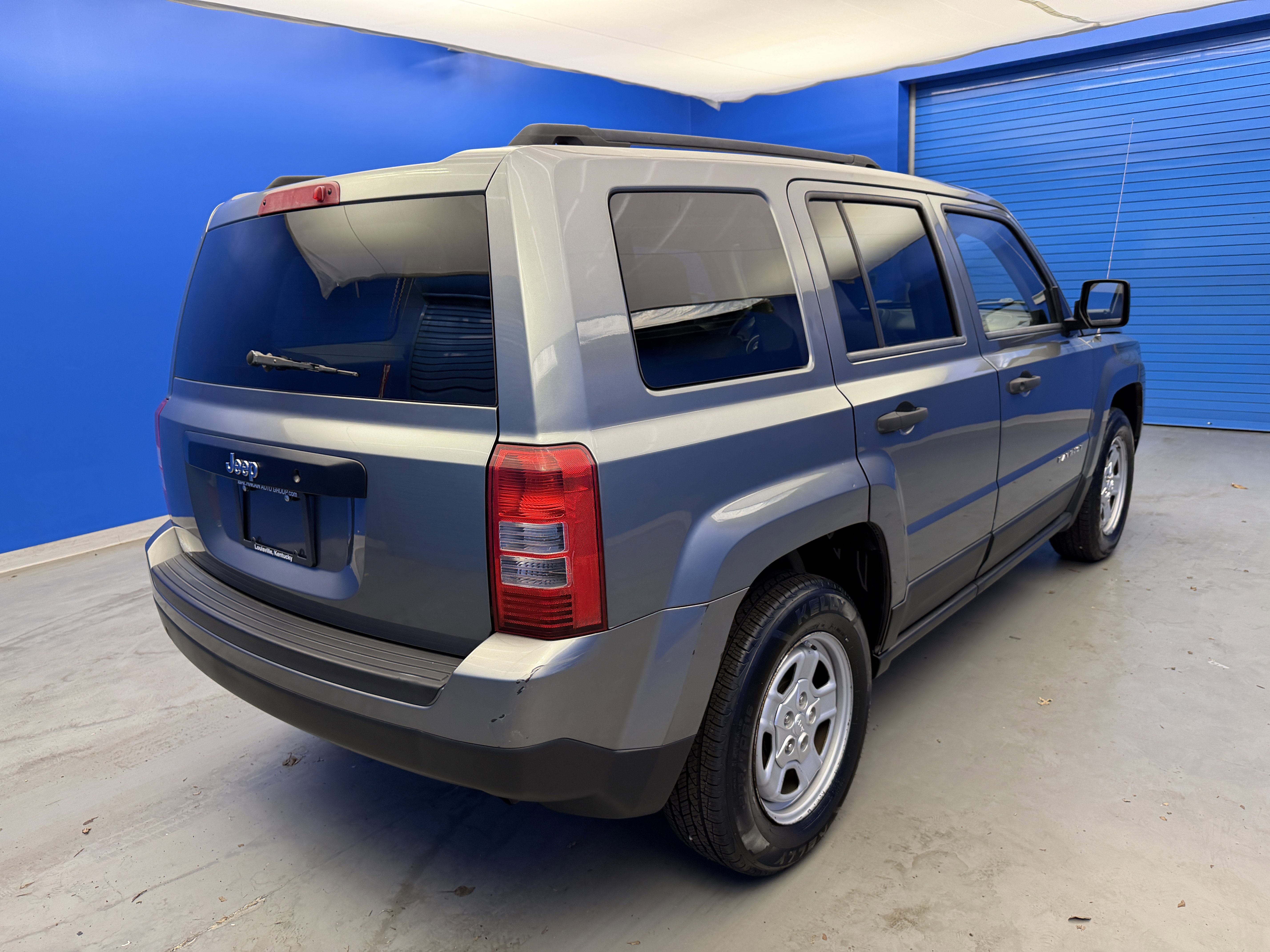Used 2012 Mineral Gray Metallic Jeep Sport image 7