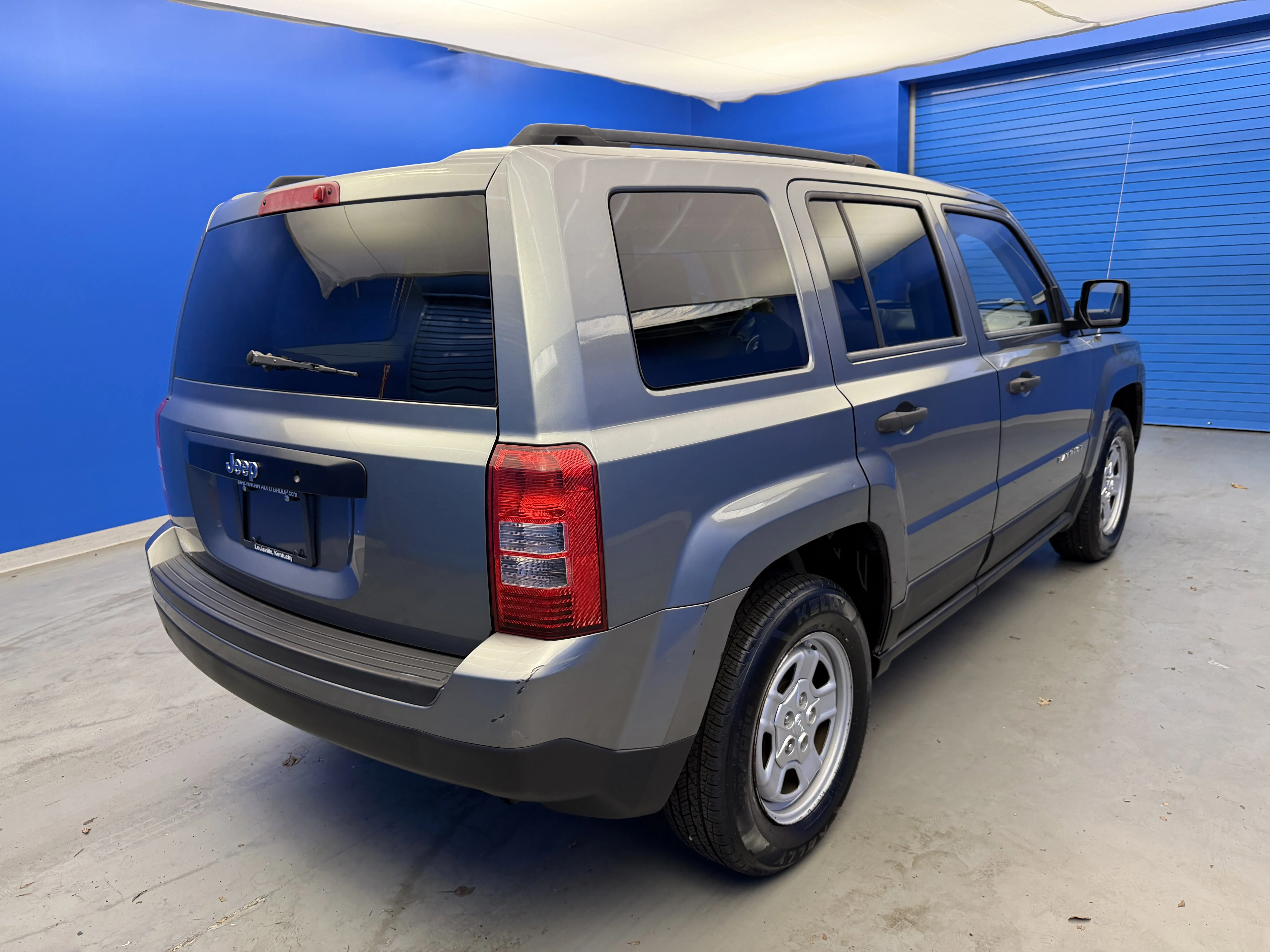 Used 2012 Mineral Gray Metallic Jeep Sport image 7