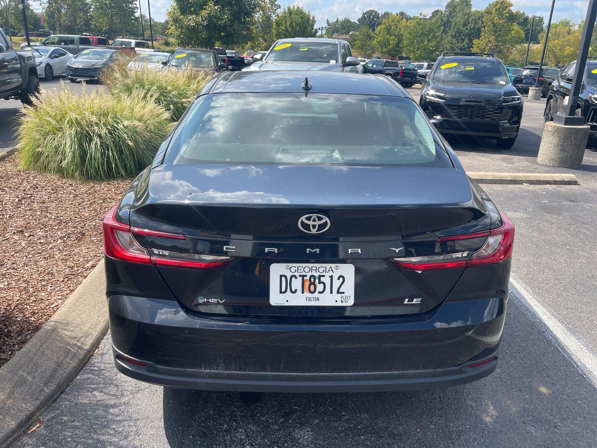 Used 2025 Midnight Black Metallic Toyota LE image 2