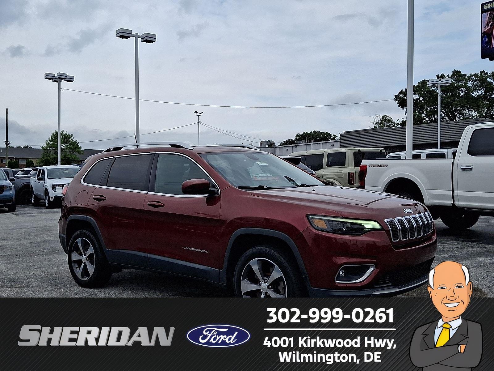 Used 2019 Velvet Red Pearlcoat Jeep Limited image 1