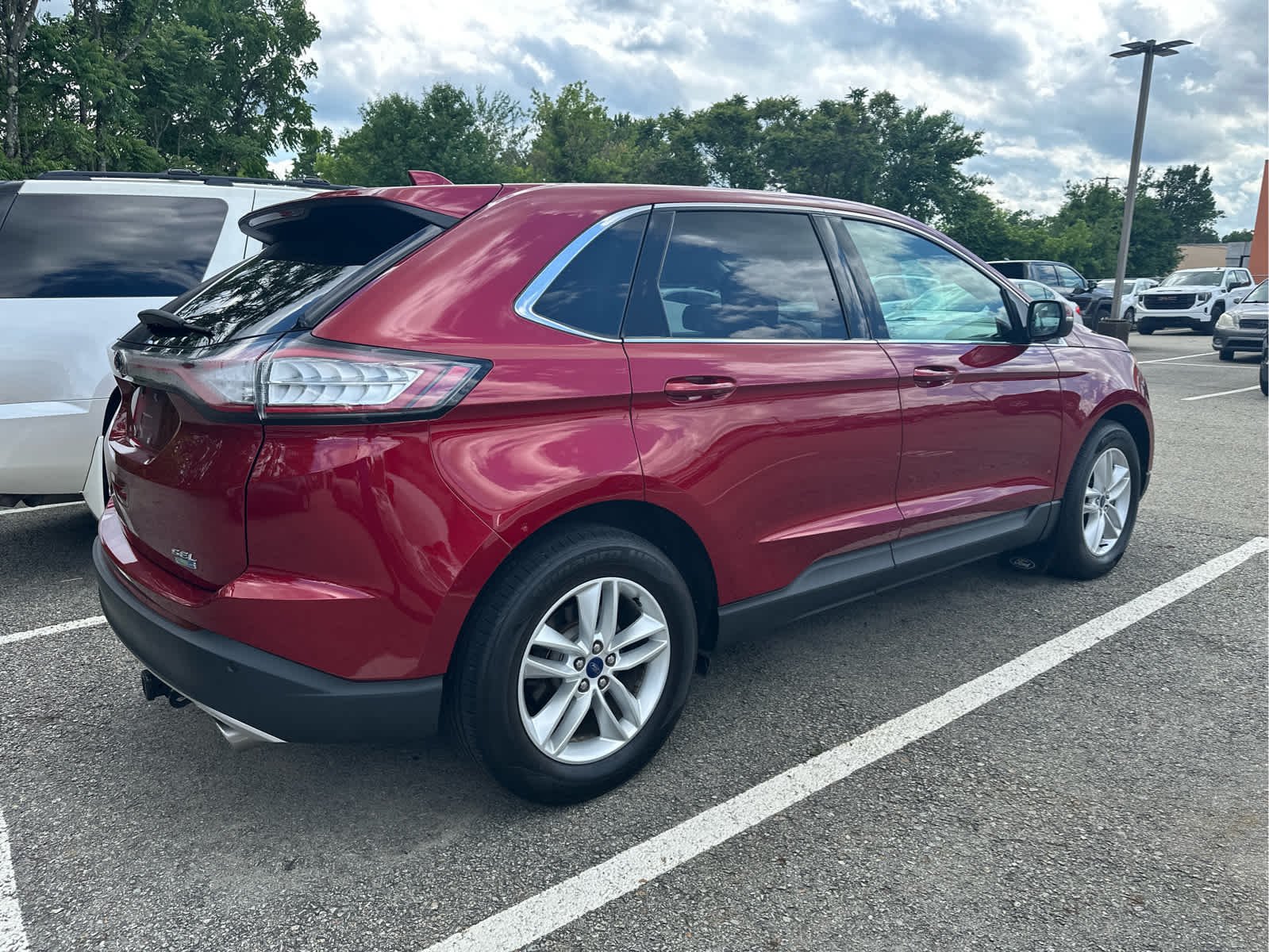 Used 2016 Ruby Red Metallic Tinted Clearcoat Ford SEL image 3