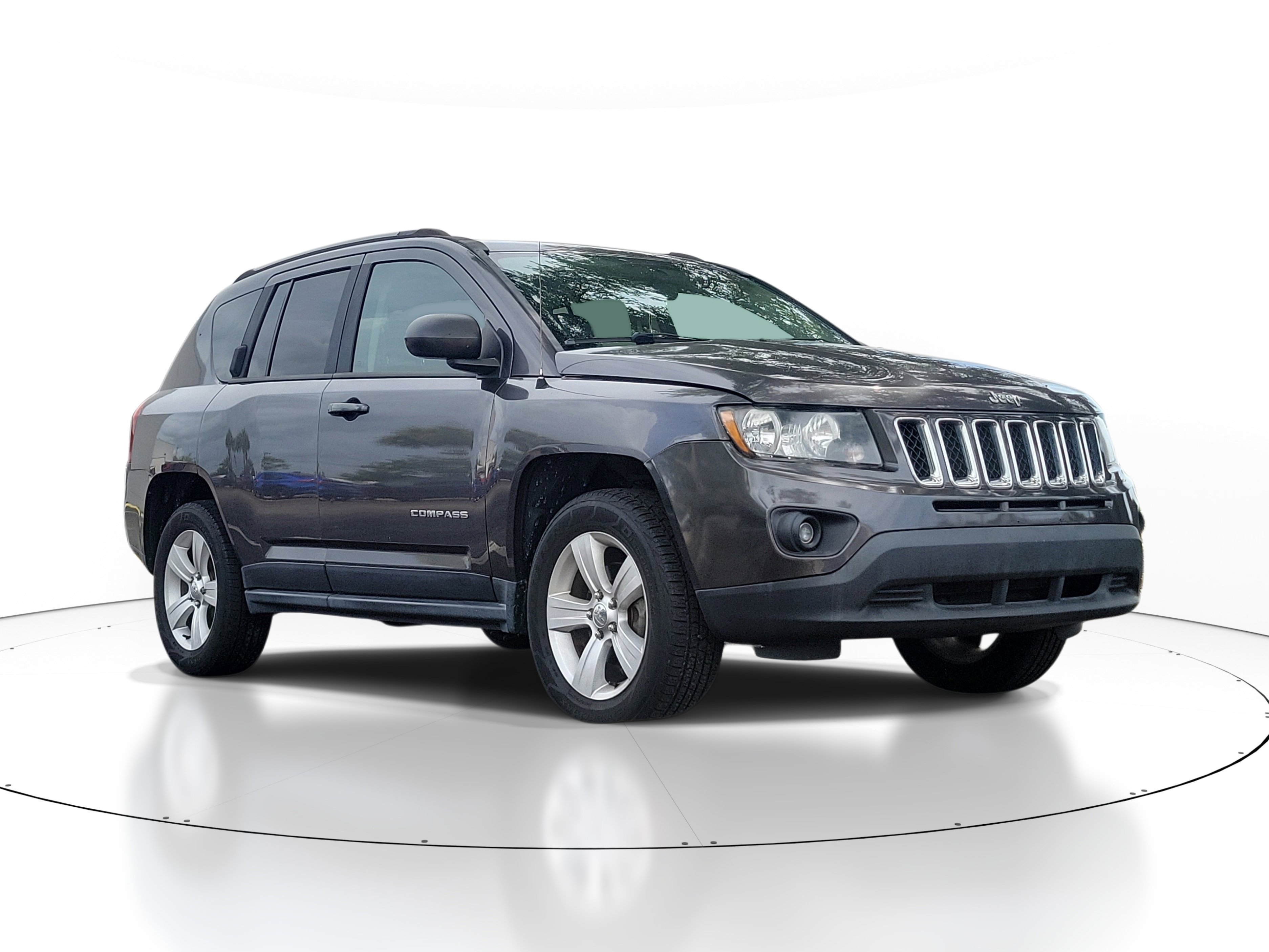 Used 2015 Granite Crystal Metallic Clearcoat Jeep Sport image 1