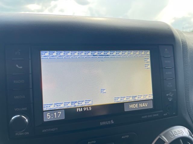 Used 2015 Blue Jeep Unlimited Sahara image 9
