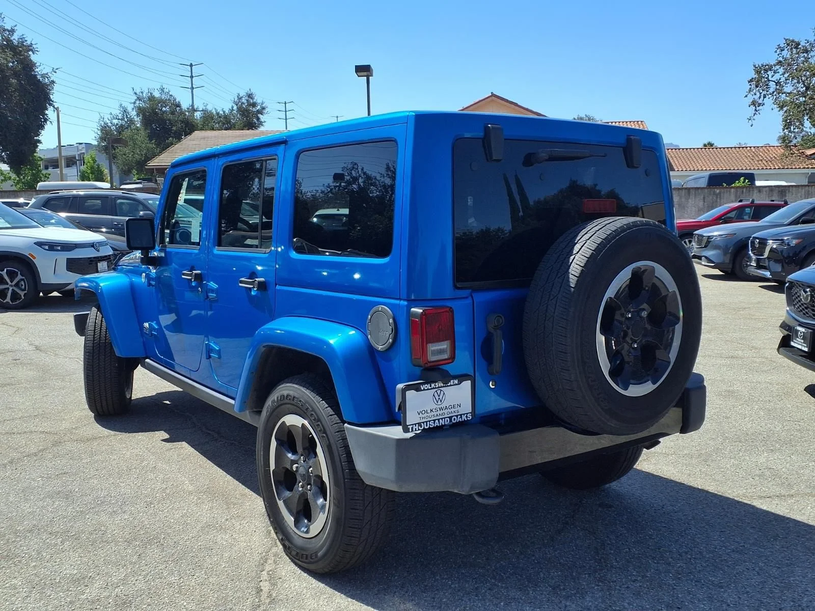 Used 2014 Blue Jeep Unlimited Sahara image 5