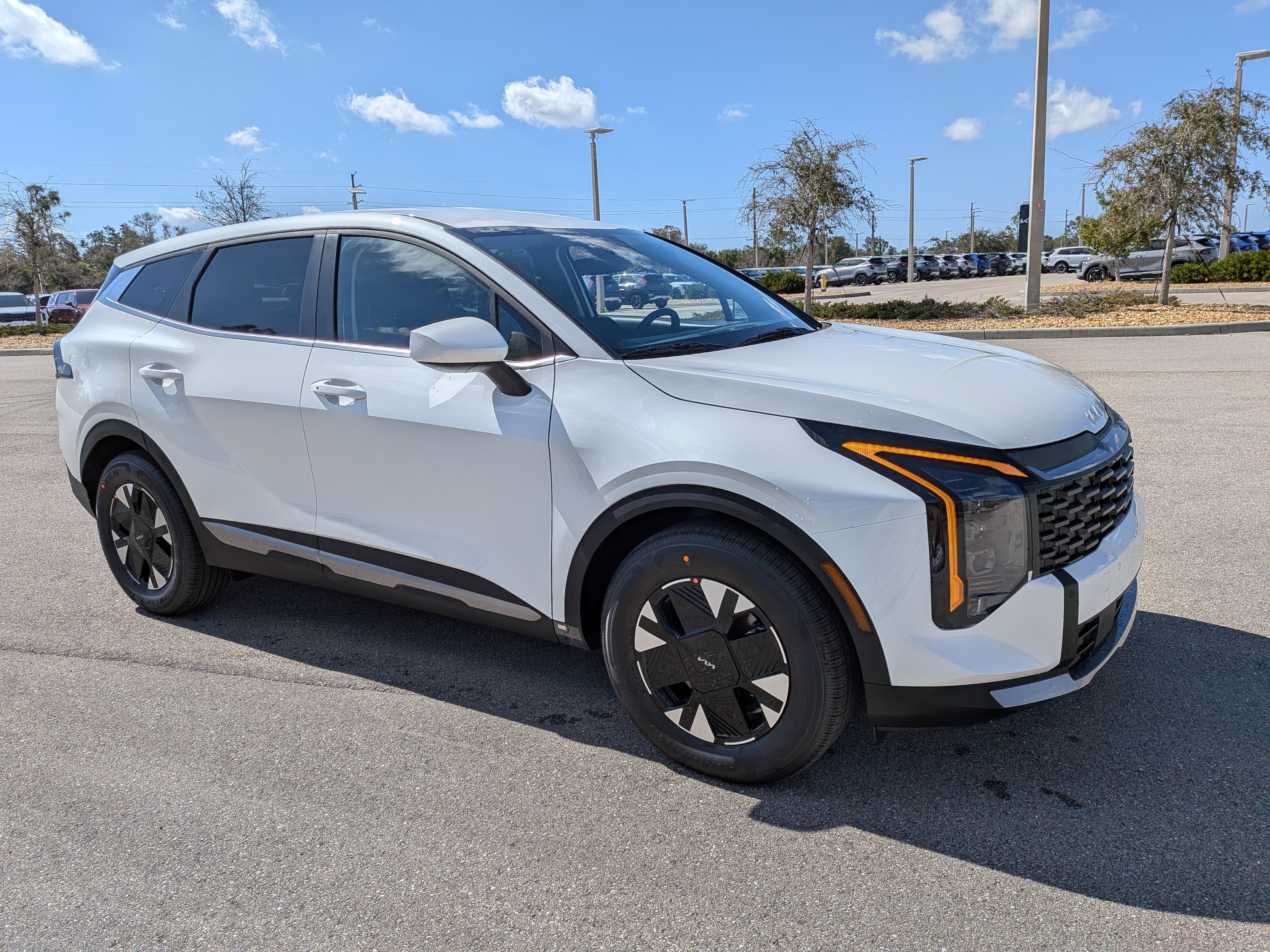 New 2026 Snow White Pearl Kia LX image 2