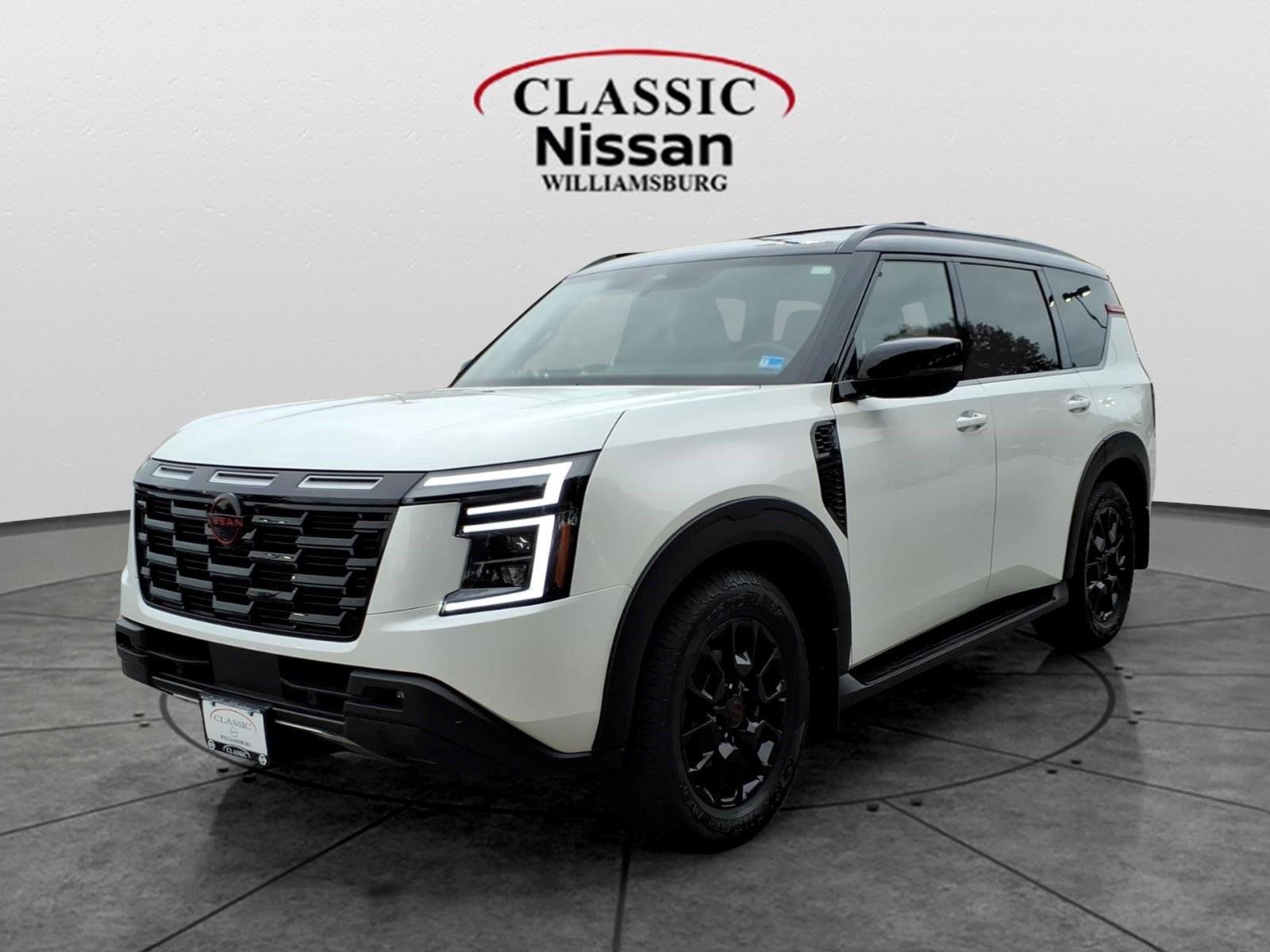Used 2025 Aspen White Tricoat/Super Black Nissan PRO-4X image 1