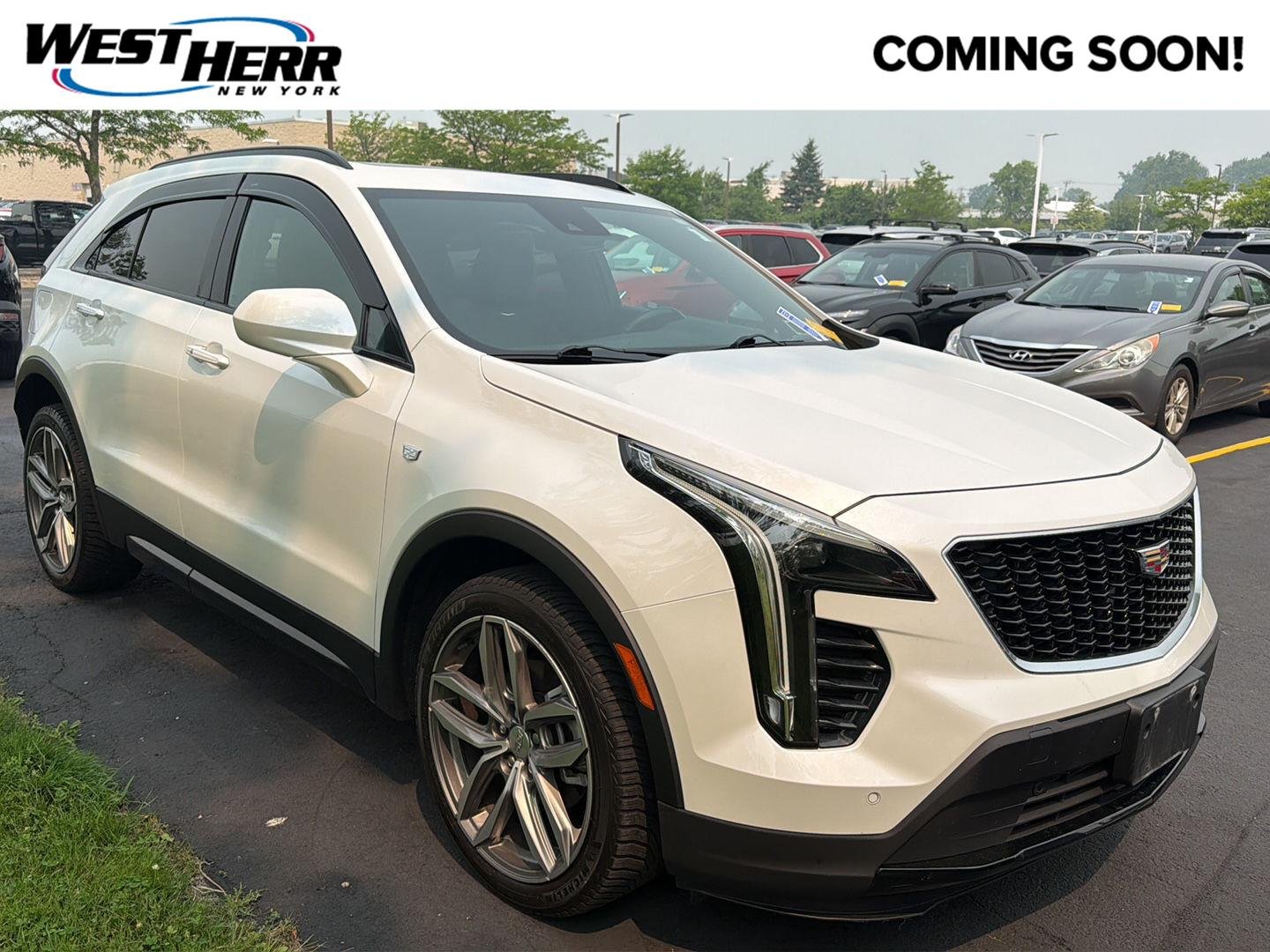 Used 2020 Crystal White Tricoat Cadillac AWD Sport image 1