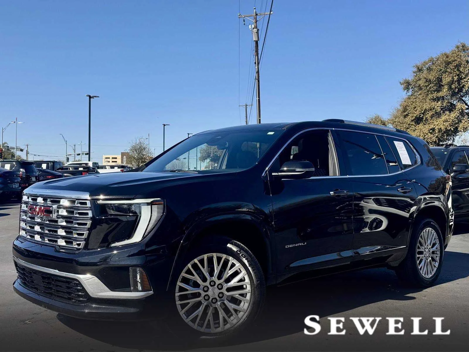 Used 2024 Ebony Twilight Metallic GMC Denali image 1