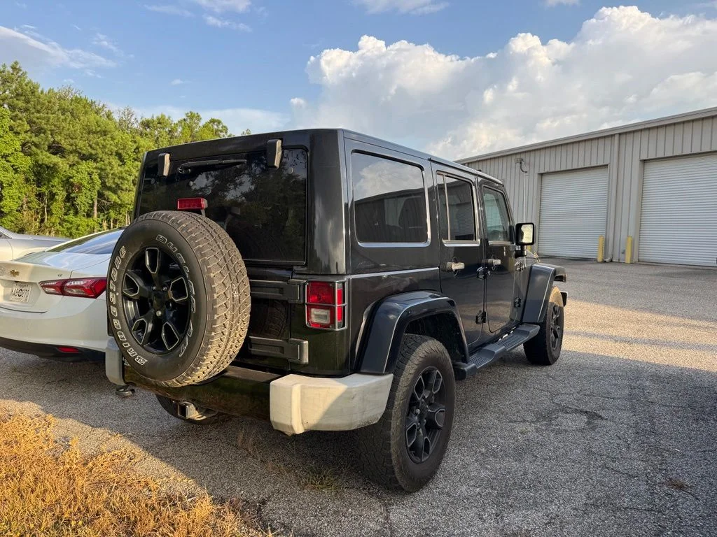 Used 2017 Black Jeep Unlimited Sahara image 7