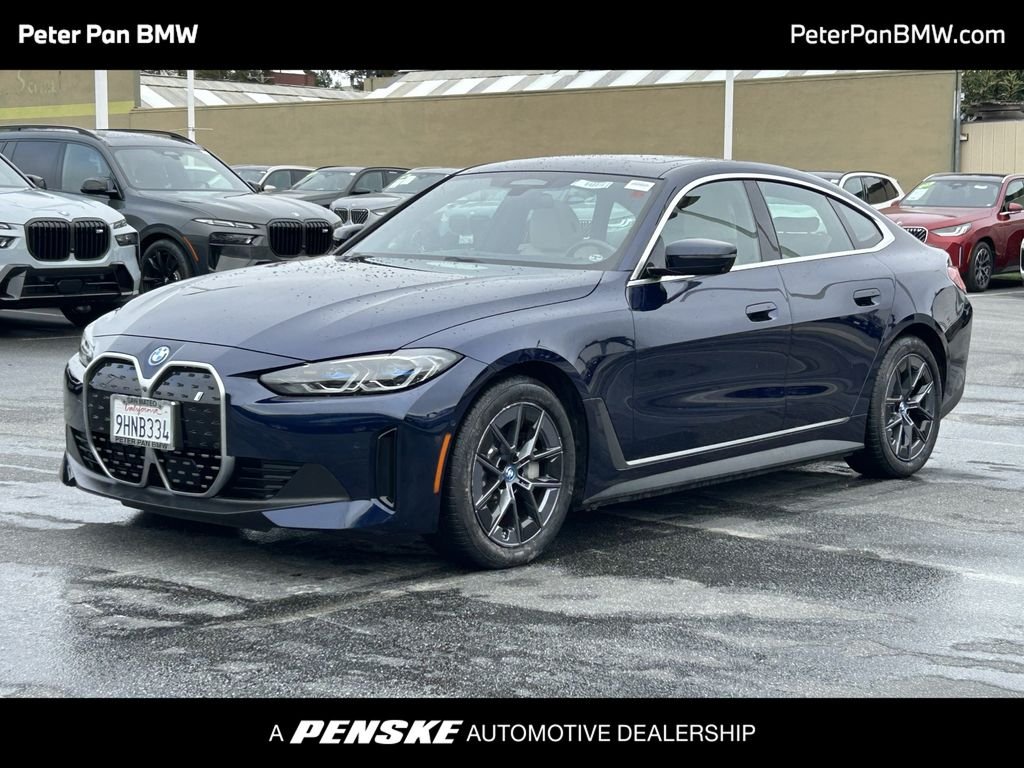 Certified Used 2023 Tanzanite Blue II Metallic BMW eDrive40 image 1