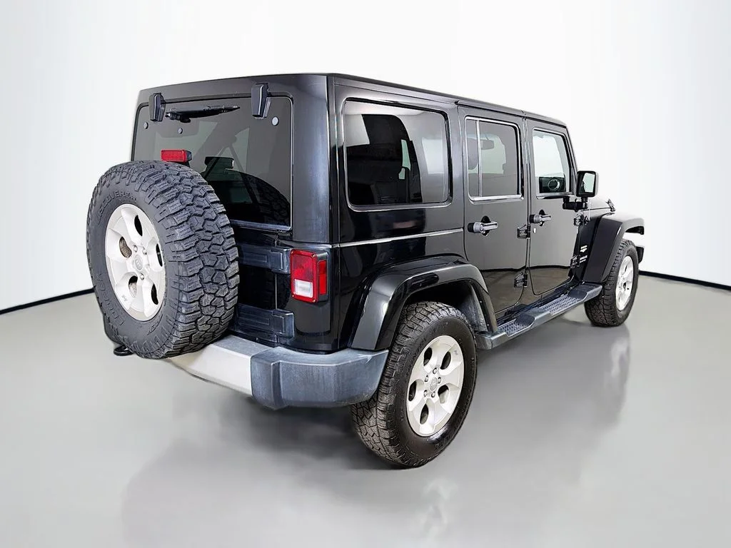 Used 2015 Black Jeep Unlimited Sahara image 6