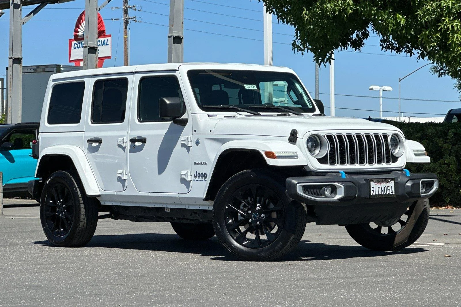 Used 2024 Bright White Clearcoat Jeep Sahara image 1