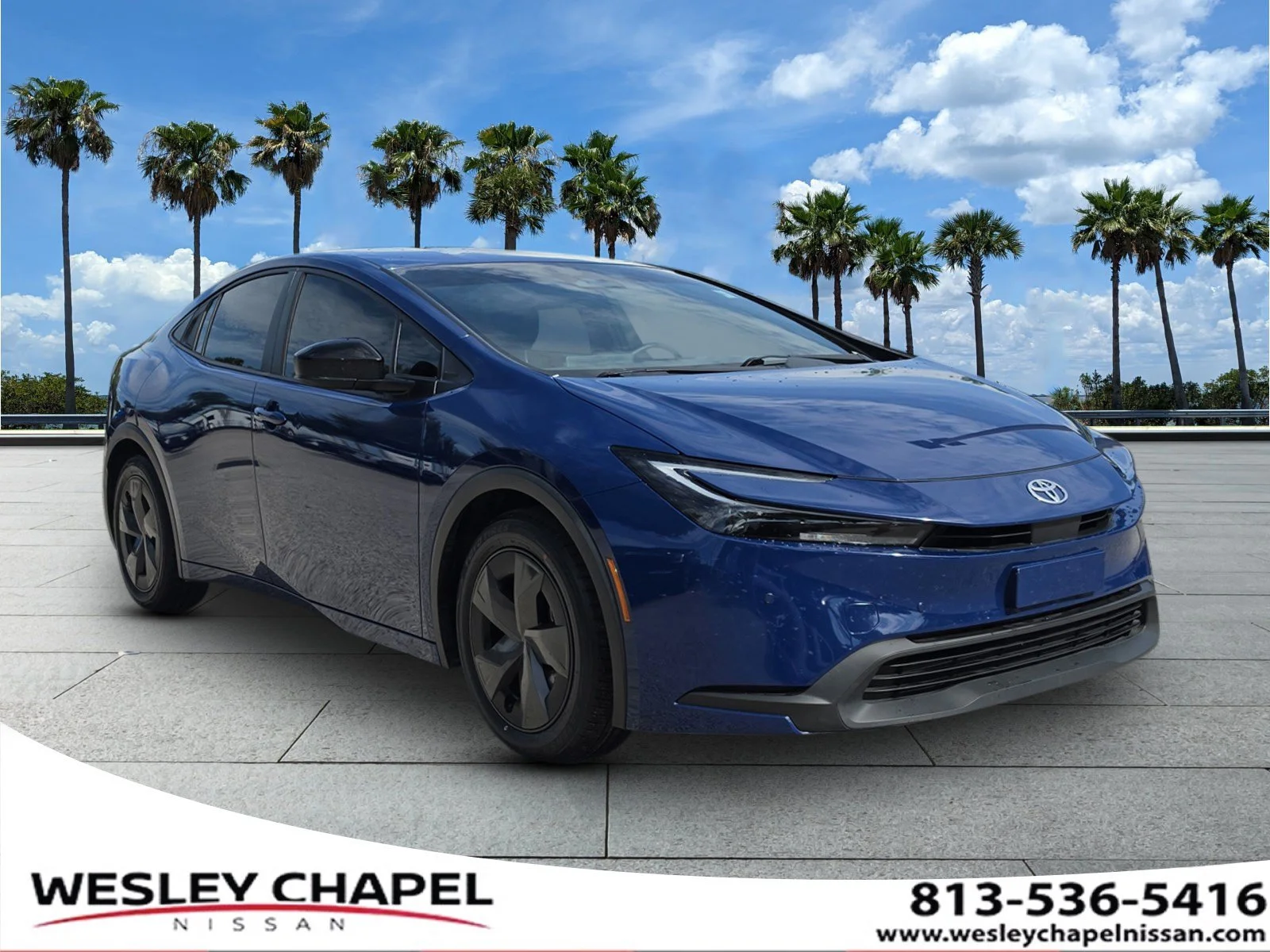 Used 2024 Reservoir Blue Toyota LE image 1