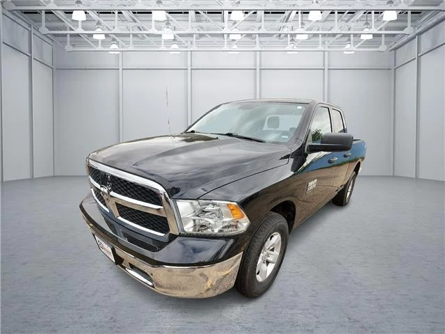 Used 2024 Black RAM SLT 4x4 Quad Cab 6.3 ft. box 140 in. WB image 1