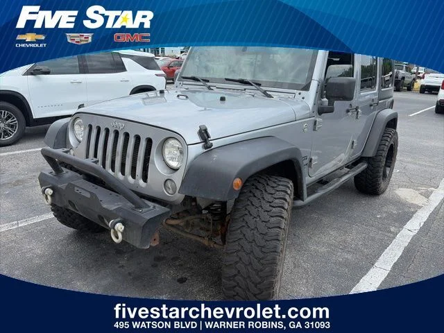 Used 2015 Silver Jeep Unlimited Sport image 1