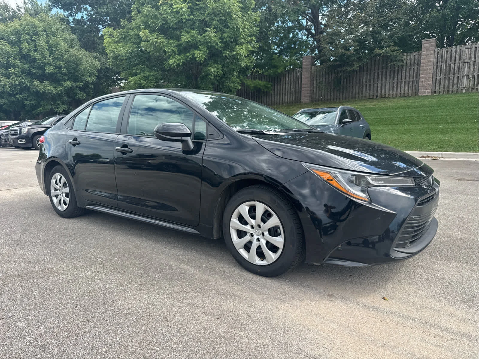 Used 2025 Midnight Black Metallic Toyota LE image 1