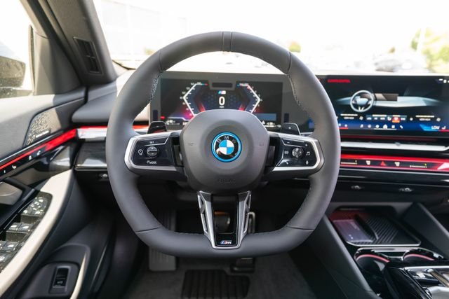 New 2027 Black Sapphire Metallic BMW 550e xDrive image 16