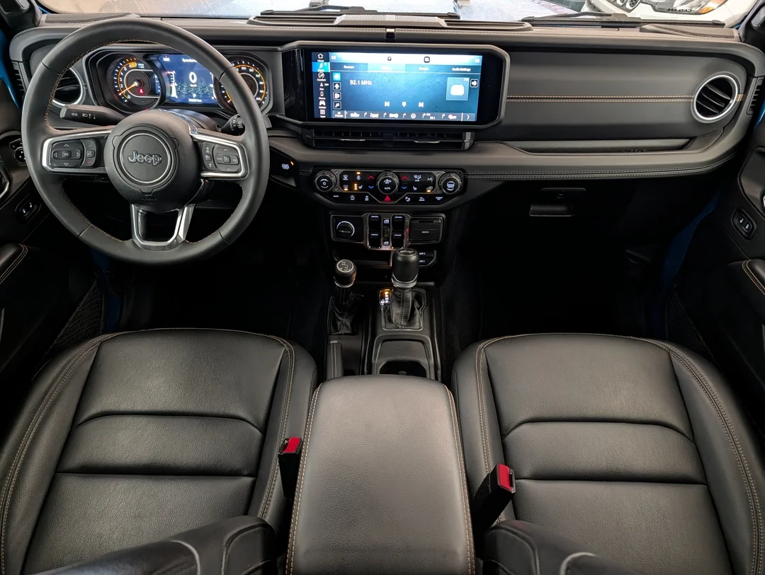Used 2024 Blue Jeep Sahara - - 4x4 - Leather Seats - Power Soft Top - Remote Start & More! image 26