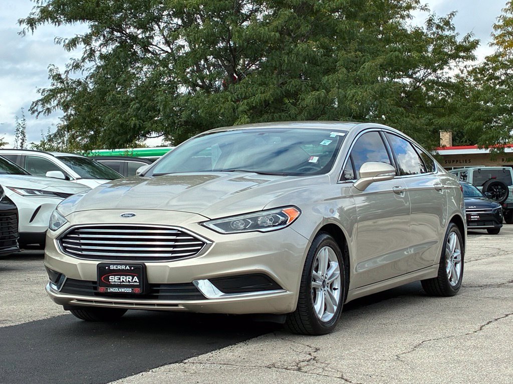 Used 2018 Gold Ford SE image 1