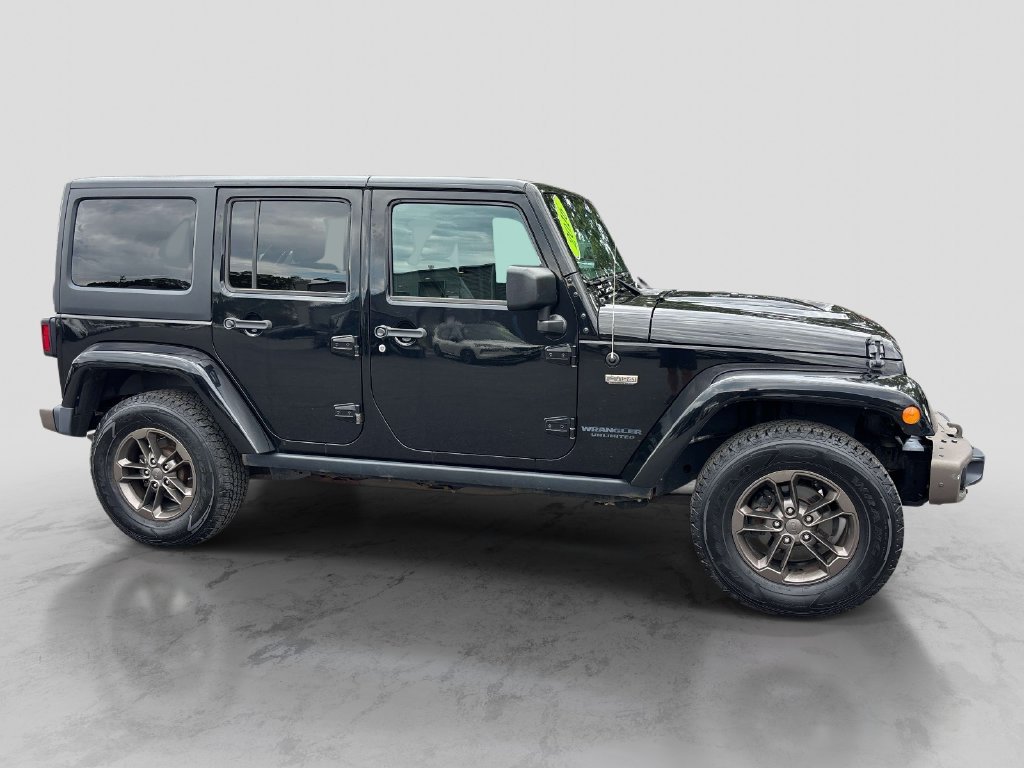 Used 2016 Black Jeep Unlimited Sahara image 6